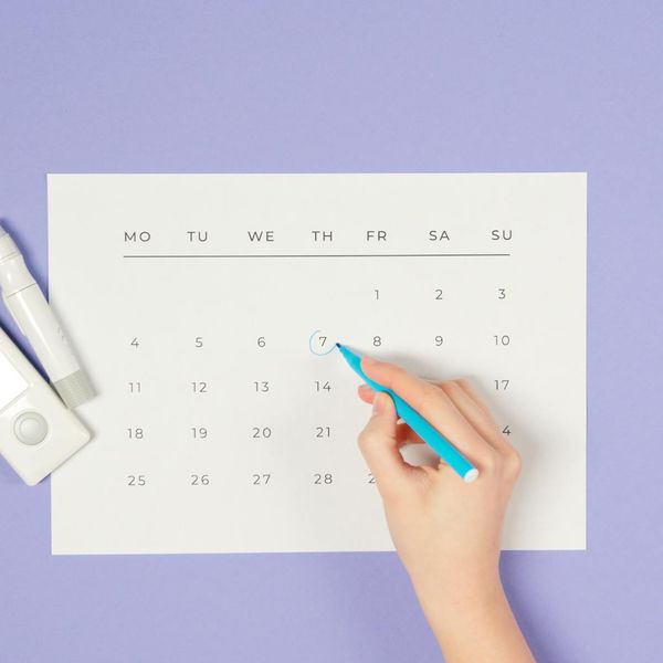A calendar with yoga days marked, showing a consistent routine.