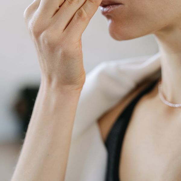 Close-up of a person's chest expanding with a deep breath during yoga.